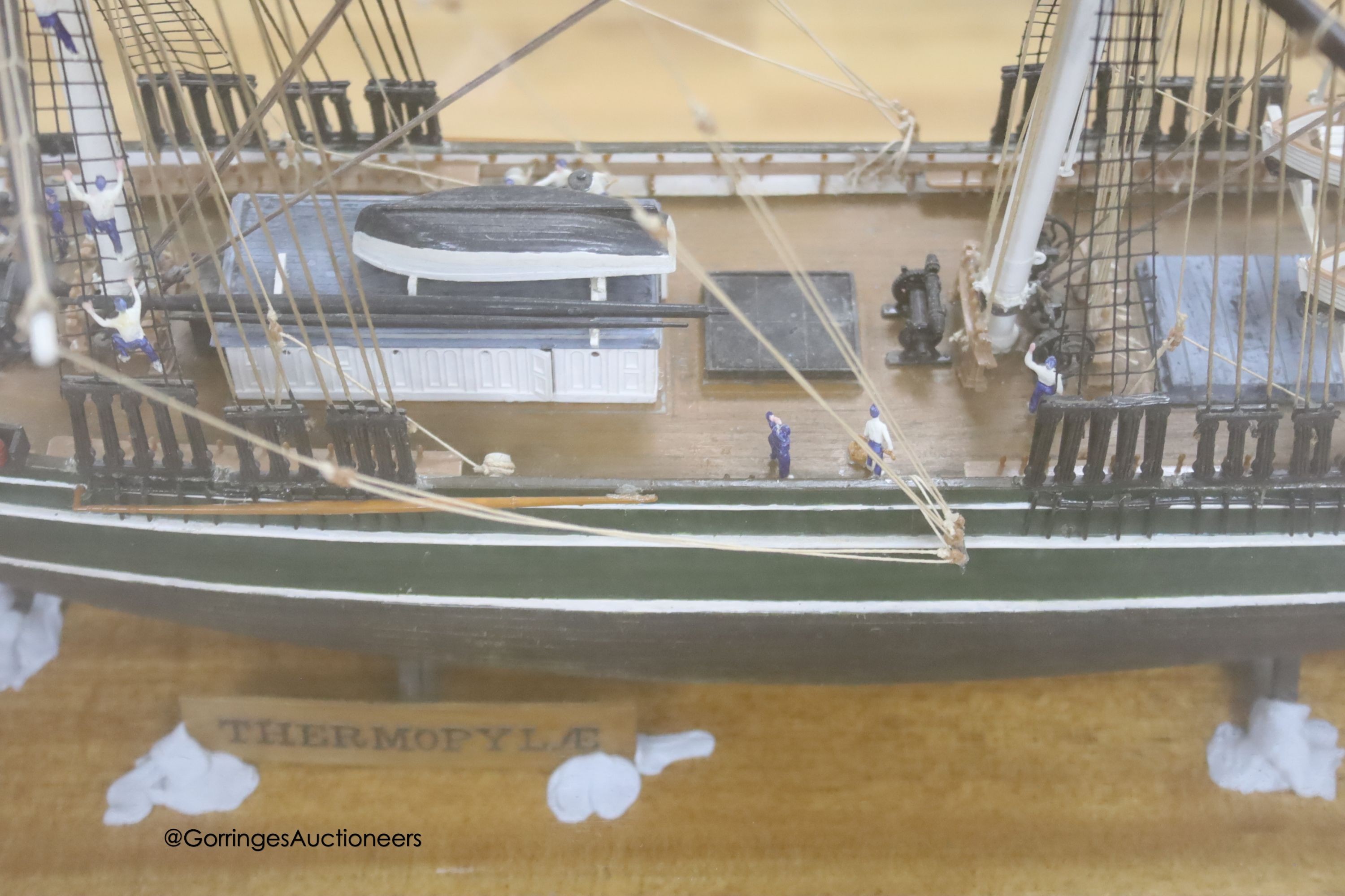 A model of a clipper ship in glazed case